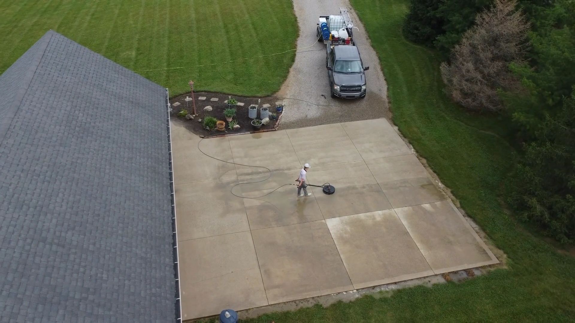 Aerial view of driveway pressure washing